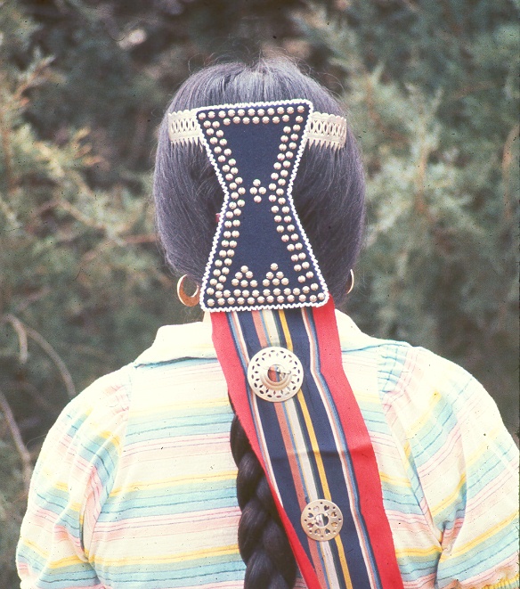 Associated image for entry 'hourglass-shaped hair ornament worn at the back of the head by the women (sometimes called a hairbow), ; the paint dishes used in the Big House'